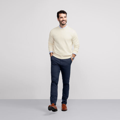 A man wearing the Anytime Crewneck Sweater in Cream