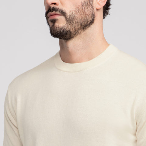 Man in Anytime Crewneck Sweater in Cream in lifestyle setting