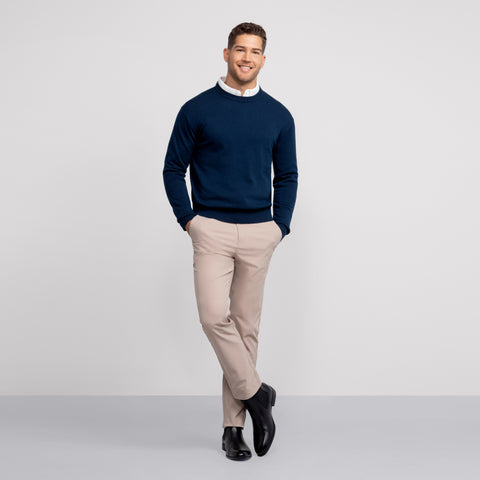 A man wearing the Anytime Crewneck Sweater in Deep Blue
