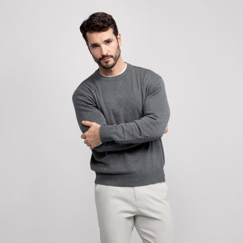A man wearing the Anytime Crewneck Sweater in Gray Heather