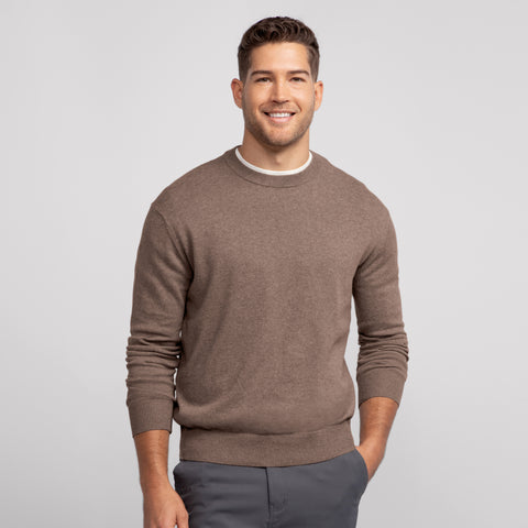 A man wearing the Anytime Crewneck Sweater in Mocha