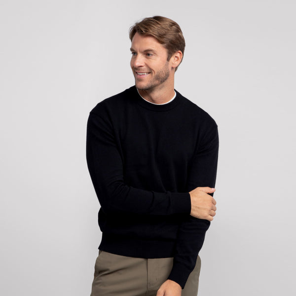 A man wearing the Anytime Crewneck Sweater in True Black