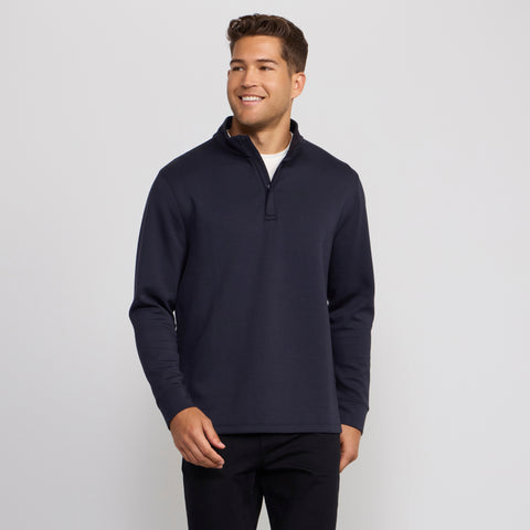 A man modeling the Sandwash Quarter-Zip in Deep Blue from the front