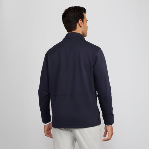 Man wearing the Sandwash Quarter-Zip in Deep Blue in lifestyle setting