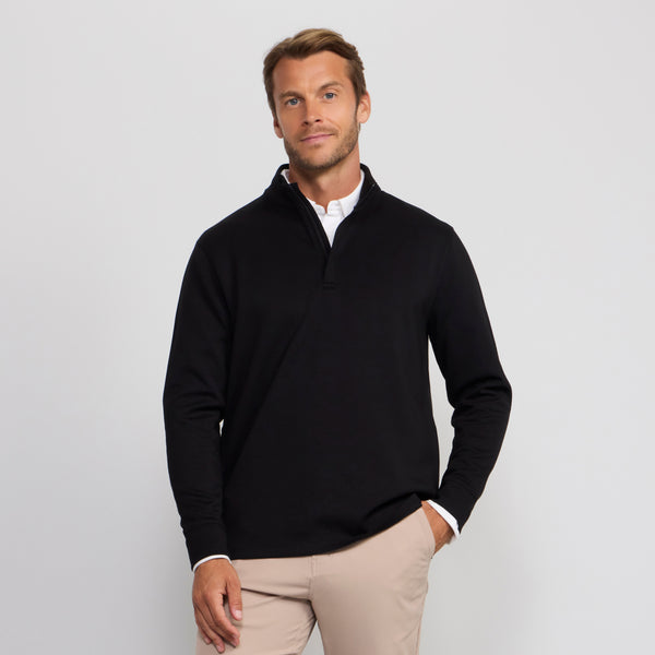 A man wearing the Sandwash Quarter-Zip in True Black, front view