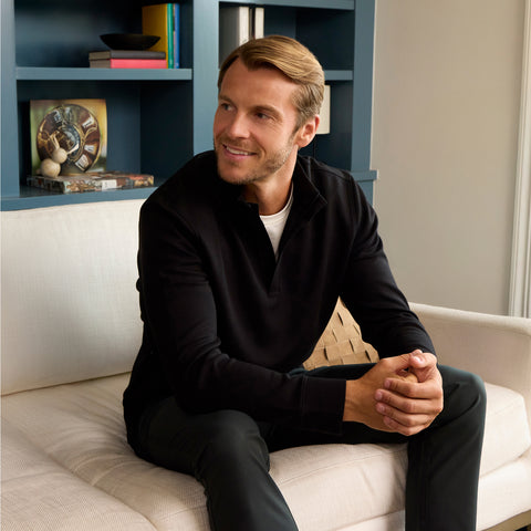 Man wearing the Sandwash Quarter-Zip True Black in a lifestyle scene