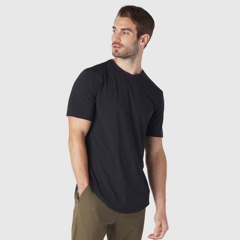 A man wearing the Anytime Tee in Deep Blue, front view.