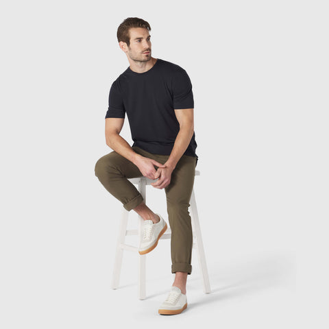 A man wearing the Anytime Tee in Deep Blue.