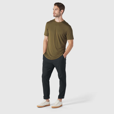 A man wearing the Anytime Tee in Olive Green