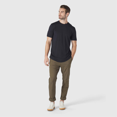 A man wearing the Anytime Tee in Space Black