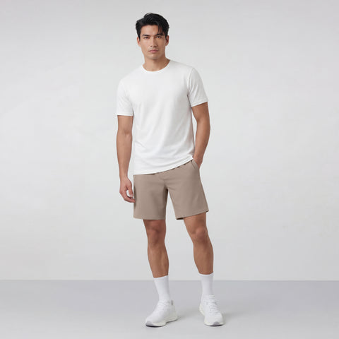 A man wearing the Atlas Short 8" in Desert Taupe