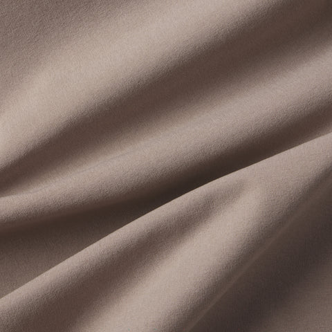 A man wearing the Atlas Short 8" in Desert Taupe
