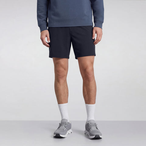 A man wearing the Atlas Short in Navy