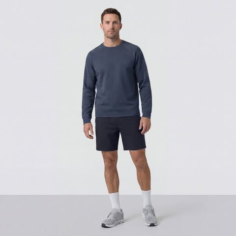 The Atlas Short 8 inch in Navy Blue shown from the side on a model