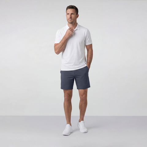 A man wearing the Atlas Short 8 inch in Slate Blue in a lifestyle setting