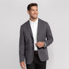 A man wearing the Jetsetter Blazer in Charcoal Gray, front view