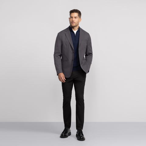The Jetsetter Blazer Charcoal Gray shown from the side on a model