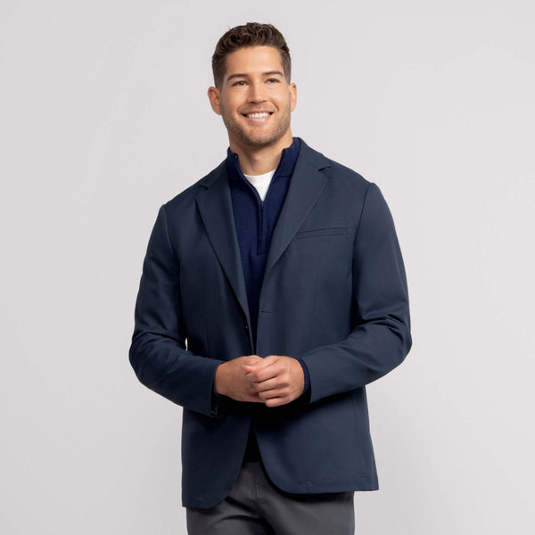 A man wearing the Jetsetter Blazer in Deep Blue