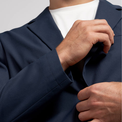 A man in the Jetsetter Blazer in Deep Blue, lifestyle setting
