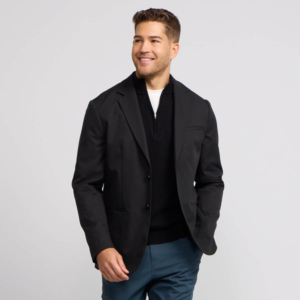 A man wearing the Jetsetter Blazer in True Black, front view