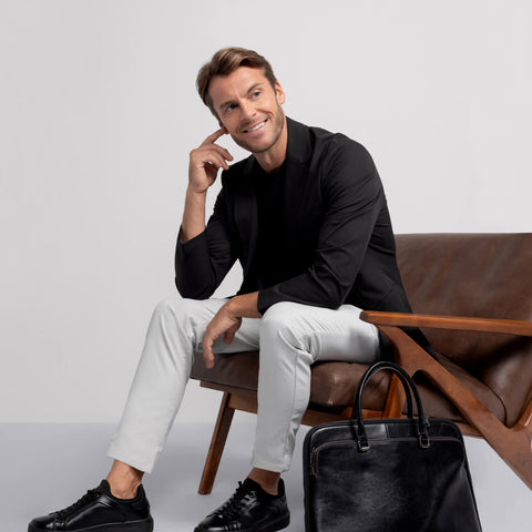 The Jetsetter Blazer True Black worn while seated, showing comfort