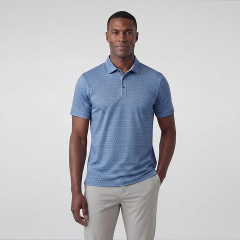 A man wearing the Clubhouse Pique Polo in Bering Sea Gridline