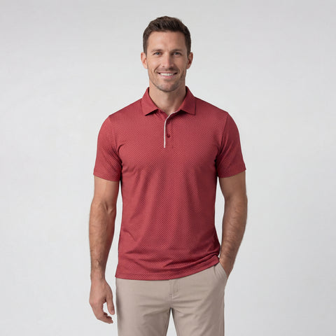 A man wearing the Clubhouse Performance Polo in Red Brickline