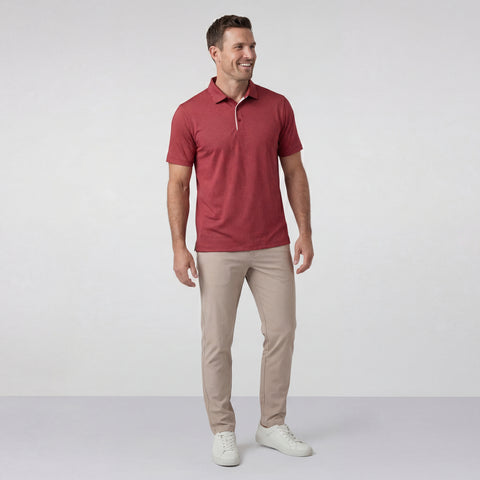 The Clubhouse Performance Polo in Red Brickline worn by a model