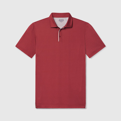 A man in the Clubhouse Performance Polo in Red Brickline outdoors
