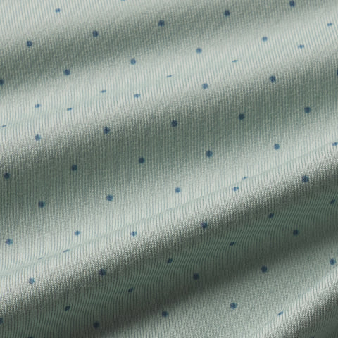 A man wearing the Clubhouse Performance Polo in Storm Green Sweetspot