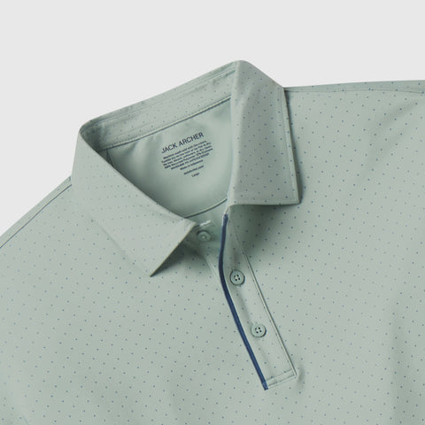 Light green polo shirt with subtle pattern on a light gray background