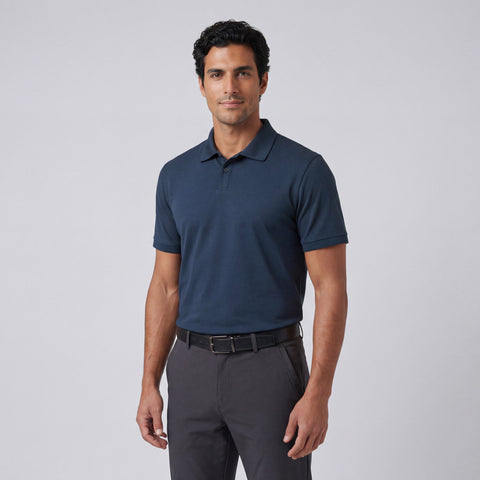 A man wearing the Clubhouse Pique Polo in Tidal Blue