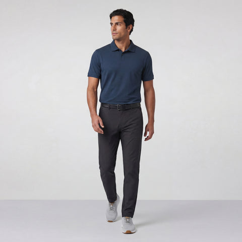 The Clubhouse Pique Polo in Tidal Blue worn by a model