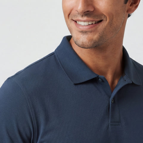 A man wearing the Clubhouse Pique Polo in Tidal Blue