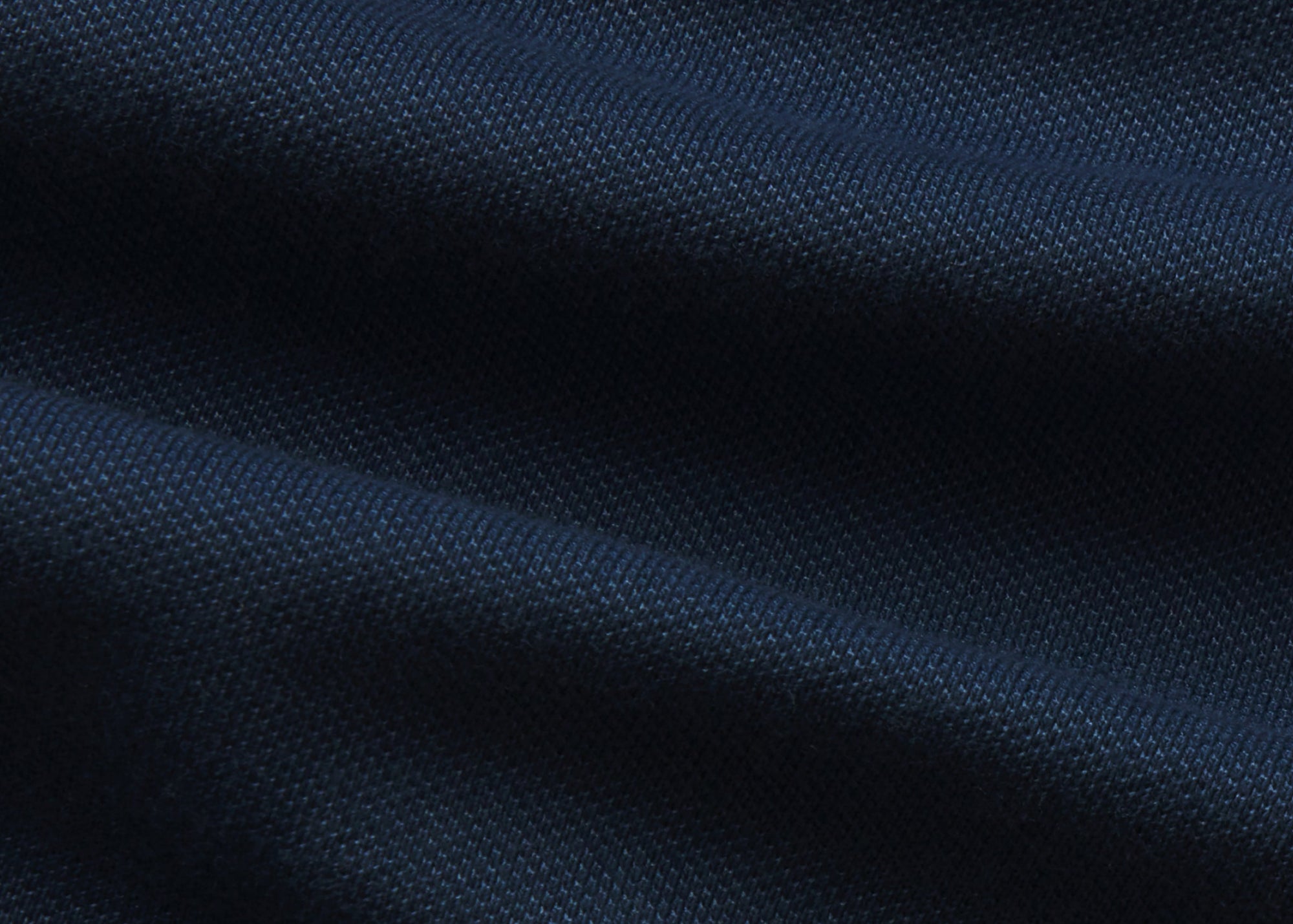 The Clubhouse Pique Polo in Tidal Blue on a neutral background