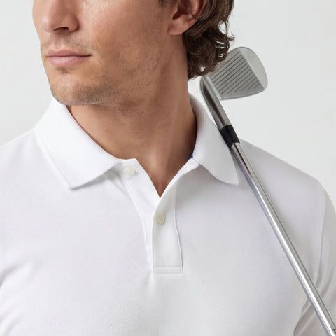 A man wearing the Clubhouse Pique Polo in True White in casual setting.