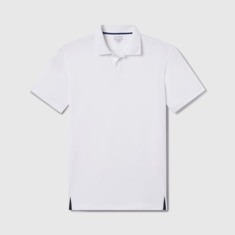 The Clubhouse Pique Polo in True White, flat lay on white background.