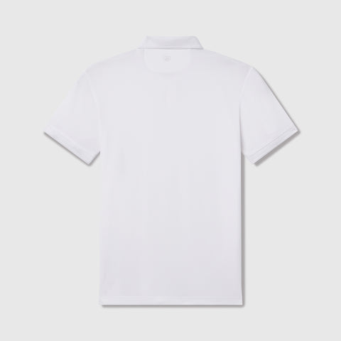 A man wearing the Clubhouse Pique Polo in True White, lifestyle shot.