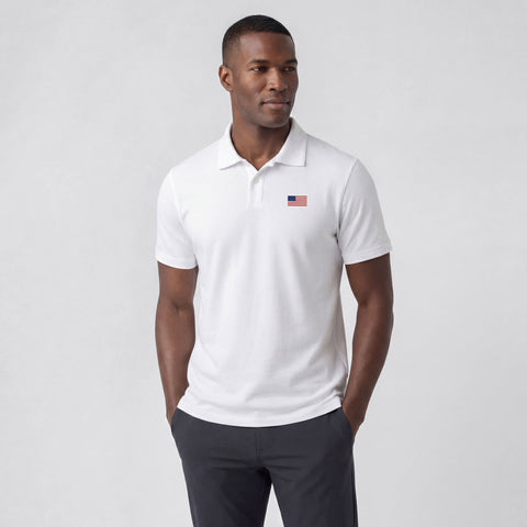 A man wearing the Clubhouse Pique Polo USA Flag, front view.