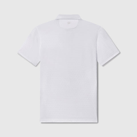 A man in the Clubhouse Performance Polo White Driveline in lifestyle setting.