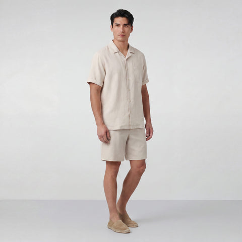 The Getaway Linen Short in Canvas worn by a model