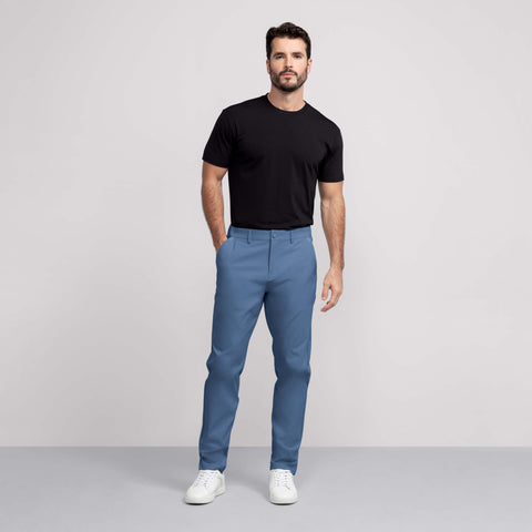 A man wearing the Jetsetter Tech Pant Relaxed Fit in Bering Sea