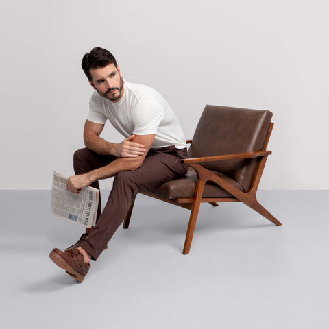 The Jetsetter Tech Pant Slim Fit in Bourbon Brown in a lifestyle setting.