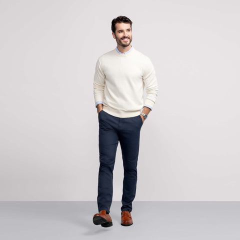 A man wearing the Jetsetter Tech Pant Relaxed Fit in Deep Blue