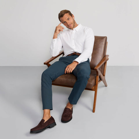The Jetsetter Tech Pant Slim Fit in Deep Teal in a lifestyle setting.