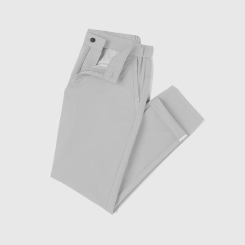 The Jetsetter Tech Pant Classic Fit in Ice Gray, folded on white background.
