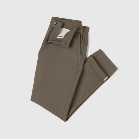The Jetsetter Tech Pant Classic Fit in Olive Green folded on a neutral background