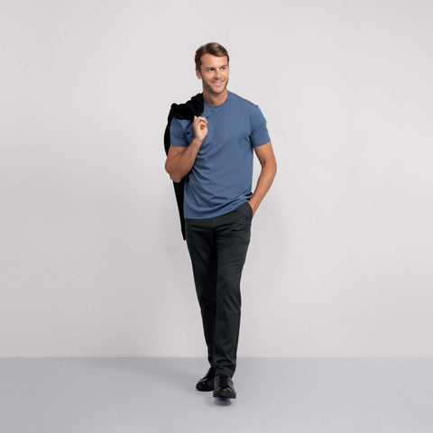 A model wearing the Jetsetter Tech Pant Slim Fit in Space Black.