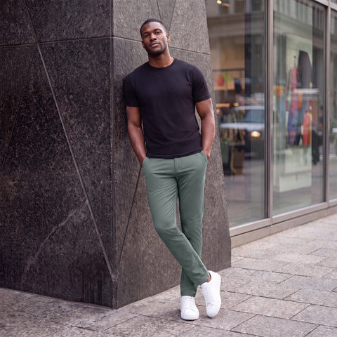 The Jetsetter Tech Pant Straight Fit in Storm Green, worn while sitting