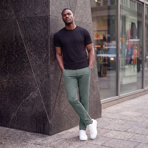 The Jetsetter Tech Pant Straight Fit in Storm Green, worn while sitting